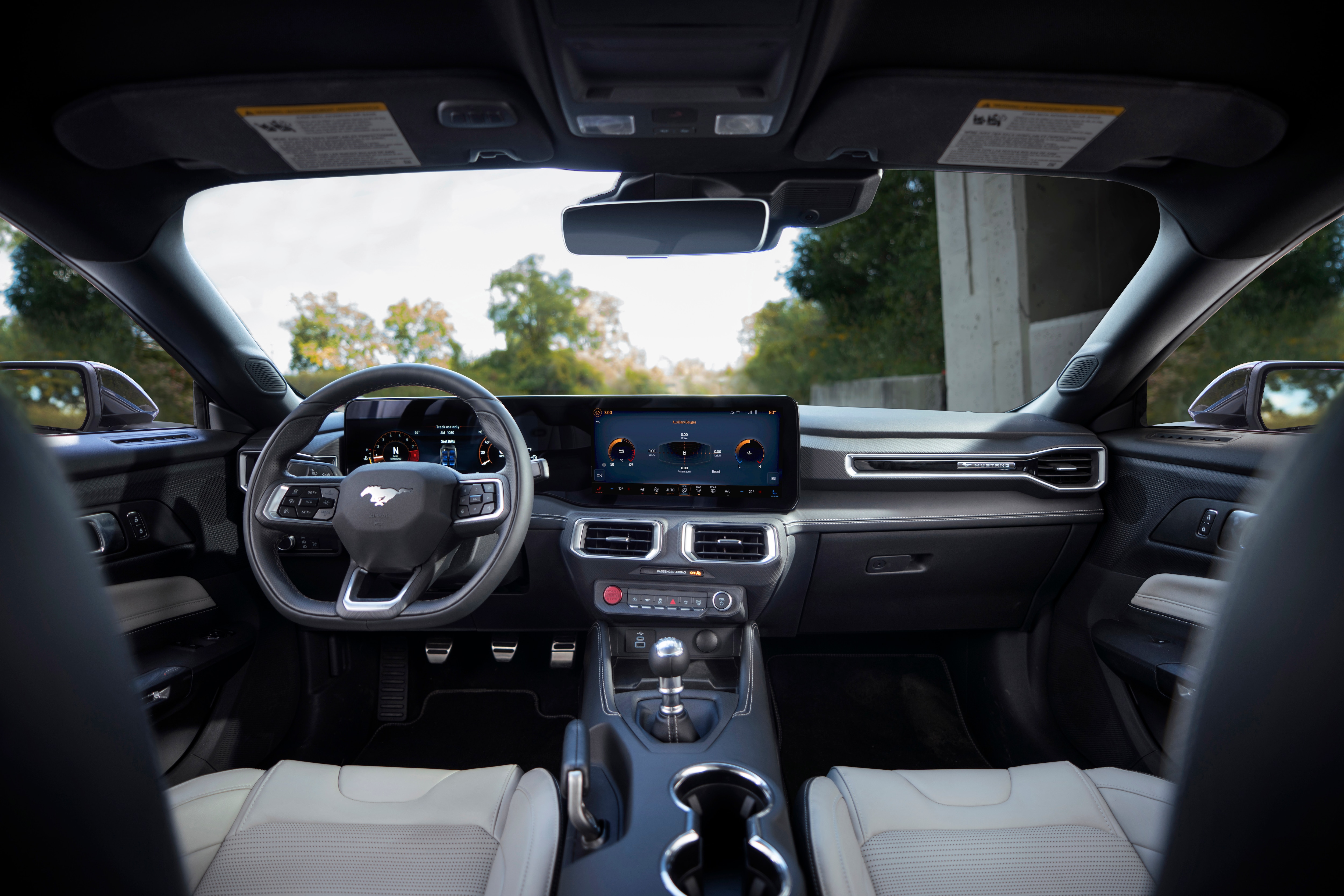 The interior of the new Mustang is the most technologically advanced, driver-centric cockpit of any Mustang to date. The fighter jet-inspired cockpit offers the driver two flowing and curved displays that can be quickly customized to show information the driver wants or needs to see. Pre-production vehicles shown